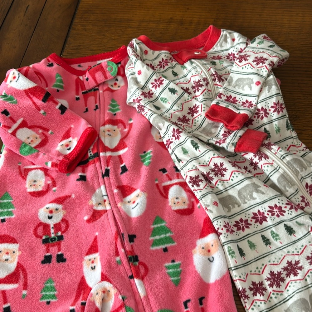 2 pairs zip front footed pajamas. Christmas/winter. Burt’s Bees and Carter’s 6mo